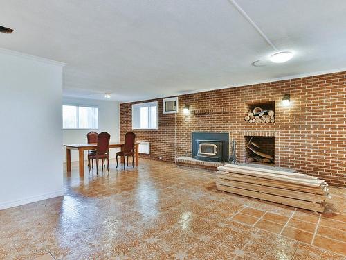 Living room - 609 Rue Poitras, L'Épiphanie, QC - Indoor With Fireplace