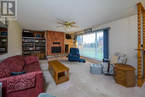 10750 Hartman Road, Prince George, BC - Indoor Photo Showing Living Room With Fireplace