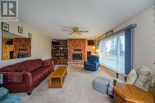 10750 Hartman Road, Prince George, BC - Indoor Photo Showing Living Room With Fireplace