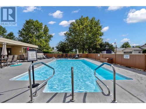 1255 Raymer Avenue Unit# 122, Kelowna, BC - Outdoor With In Ground Pool With Deck Patio Veranda With Backyard