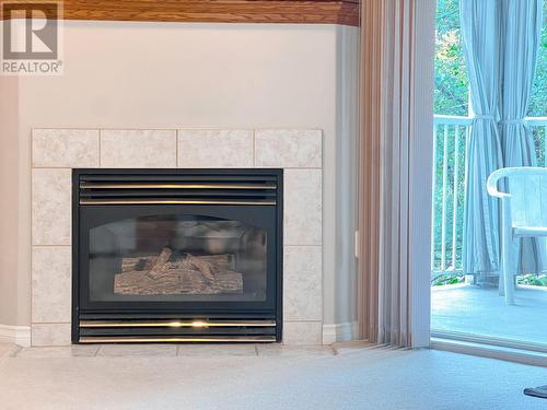 719 11Th  Avenue Unit# 204, Castlegar, BC - Indoor Photo Showing Living Room With Fireplace