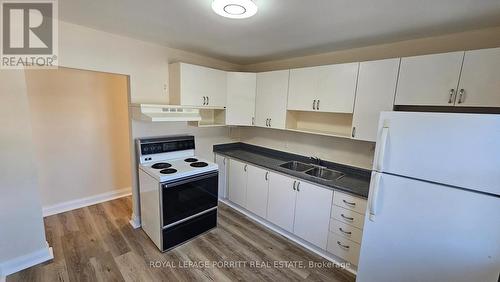 7 - 2773 Lake Shore Boulevard W, Toronto, ON - Indoor Photo Showing Kitchen With Double Sink