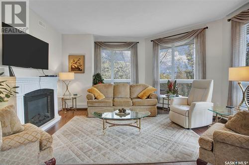 210 1025 Moss Avenue, Saskatoon, SK - Indoor Photo Showing Living Room With Fireplace