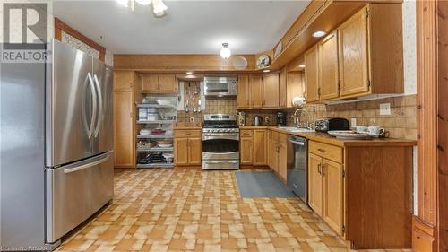 Kitchen with tasteful backsplash, sink, and appliances with stainless steel finishes - 246 Light Street, Woodstock, ON - Indoor Photo Showing Kitchen