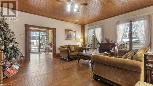 Living room featuring hardwood / wood-style flooring, ceiling fan, wood ceiling, and crown molding - 246 Light Street, Woodstock, ON - Indoor Photo Showing Living Room