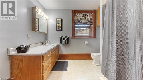 Bathroom featuring a shower with curtain, vanity, and toilet - 246 Light Street, Woodstock, ON - Indoor Photo Showing Bathroom