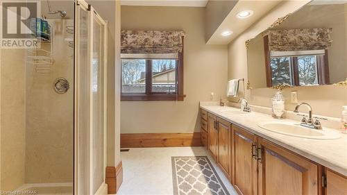 Bathroom with a tile shower, vanity, and tile patterned floors - 246 Light Street, Woodstock, ON - Indoor Photo Showing Bathroom