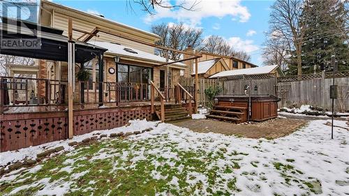 Snow covered property featuring a hot tub and a deck - 246 Light Street, Woodstock, ON - Outdoor With Deck Patio Veranda