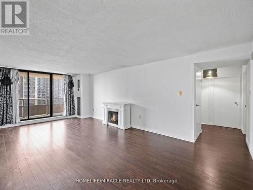 1412 - 4 Kings Cross Road, Brampton, ON - Indoor Photo Showing Other Room With Fireplace