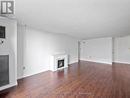 1412 - 4 Kings Cross Road, Brampton, ON - Indoor Photo Showing Living Room With Fireplace