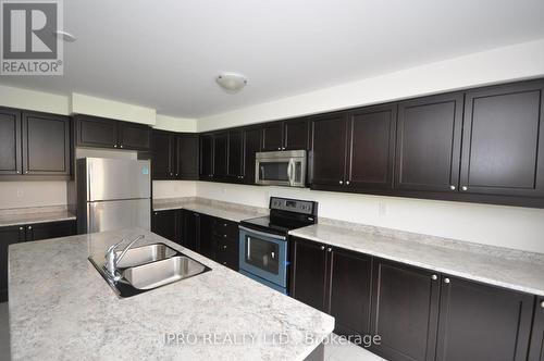 305 Gooding Crescent, Milton, ON - Indoor Photo Showing Kitchen With Double Sink