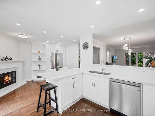 3475 Chartrand Cres, Mississauga, ON - Indoor Photo Showing Kitchen With Fireplace With Double Sink