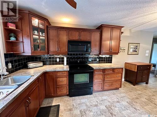 1741 Centennial Crescent, North Battleford, SK - Indoor Photo Showing Kitchen With Double Sink