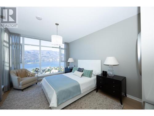 Primary with stunning lake, valley and mountain views. - 1075 Sunset Drive Unit# 2604, Kelowna, BC - Indoor Photo Showing Bedroom