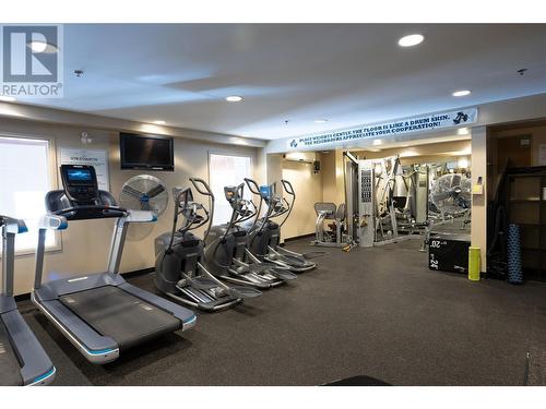 Amenities include: fitness room, lounge, billiards room, outdoor pool and hot tub, outdoor bbq area - 1075 Sunset Drive Unit# 2604, Kelowna, BC - Indoor Photo Showing Gym Room