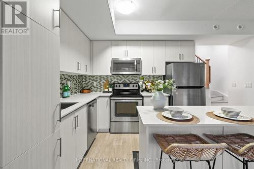 15 - 125 Long Branch Avenue, Toronto, ON - Indoor Photo Showing Kitchen With Stainless Steel Kitchen