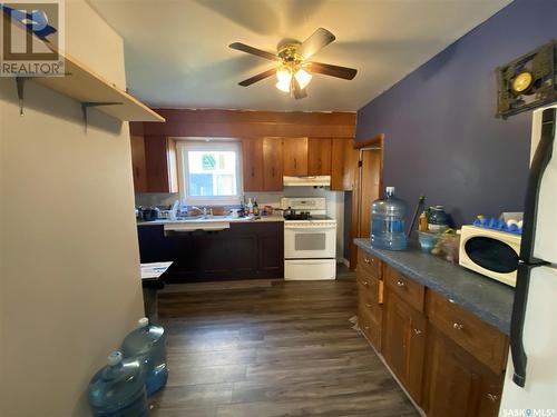 132 2Nd Street E, Ponteix, SK - Indoor Photo Showing Kitchen With Double Sink