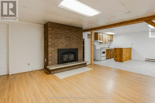 61 Beaufort Crescent, Tiny, ON - Indoor Photo Showing Living Room With Fireplace