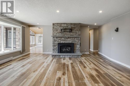 61 Beaufort Crescent, Tiny, ON - Indoor Photo Showing Living Room With Fireplace