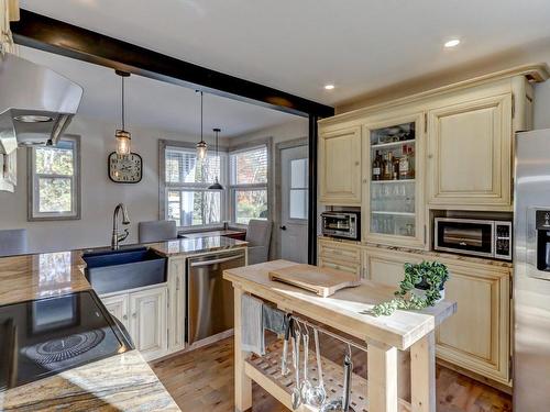 Cuisine - 445 Ch. Du Lac-Bleu, Saint-Hippolyte, QC - Indoor Photo Showing Kitchen With Fireplace