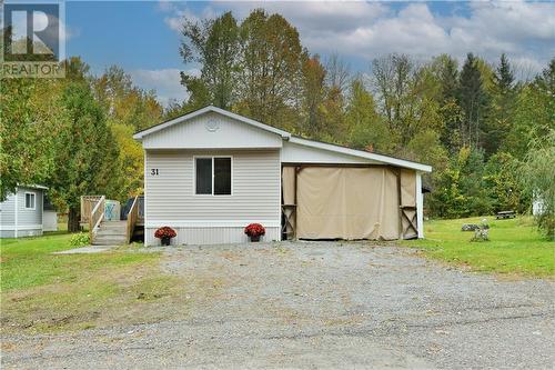 Ample room for vehicles along with a carport which is just a little work away from being a full fledged garage - 31 Robert Colin Lane, Cobden, ON - Outdoor