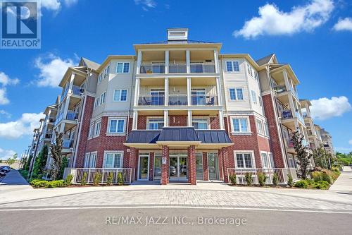 208 - 84 Aspen Springs Drive, Clarington (Bowmanville), ON - Outdoor With Facade