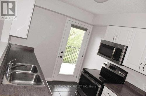 201 - 20 Cheese Factory Road, Cambridge, ON - Indoor Photo Showing Kitchen With Double Sink