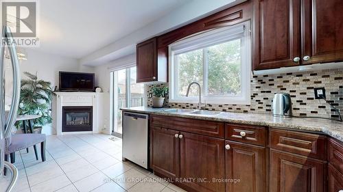 64 Eddington Place, Vaughan, ON - Indoor Photo Showing Kitchen With Fireplace With Double Sink