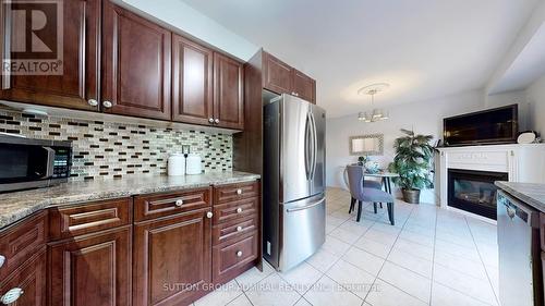 64 Eddington Place, Vaughan, ON - Indoor Photo Showing Kitchen With Fireplace