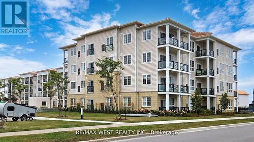 118 - 50 Lakebreeze Drive, Clarington, ON - Outdoor With Balcony With Facade