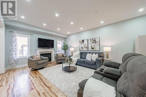 4264 Vivaldi Road E, Burlington, ON - Indoor Photo Showing Living Room With Fireplace