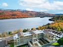 Aerial photo - 403-123 Rue Cuttle, Mont-Tremblant, QC  - Outdoor With Body Of Water With View 