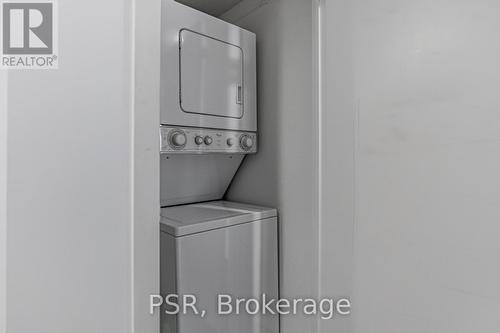 201 - 38 Joe Shuster Way, Toronto, ON - Indoor Photo Showing Laundry Room