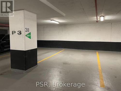 201 - 38 Joe Shuster Way, Toronto, ON - Indoor Photo Showing Garage