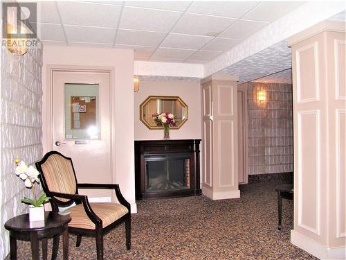 95 Windsor Drive Unit#305, Brockville, ON - Indoor With Fireplace