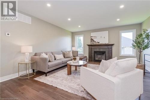 135 Ronnies Way, Mount Forest, ON - Indoor Photo Showing Living Room With Fireplace