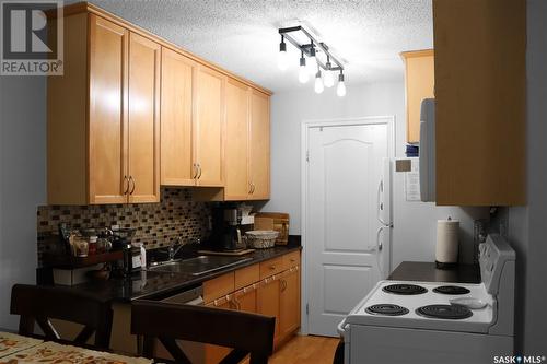 201E 1121 Mckercher Drive, Saskatoon, SK - Indoor Photo Showing Kitchen With Double Sink