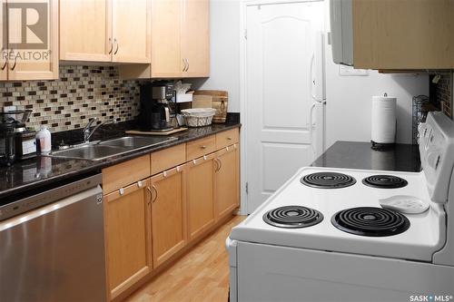 201E 1121 Mckercher Drive, Saskatoon, SK - Indoor Photo Showing Kitchen With Double Sink