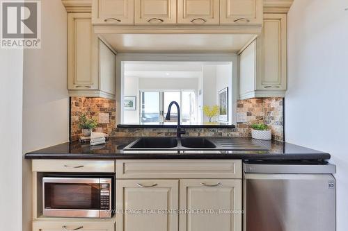 810 - 2511 Lakeshore Road W, Oakville, ON - Indoor Photo Showing Kitchen With Double Sink