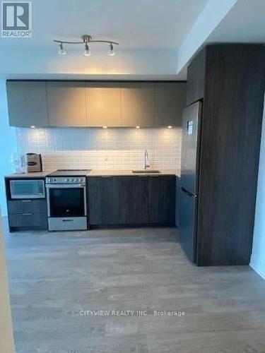 702 - 65 Annie Craig Drive, Toronto, ON - Indoor Photo Showing Kitchen