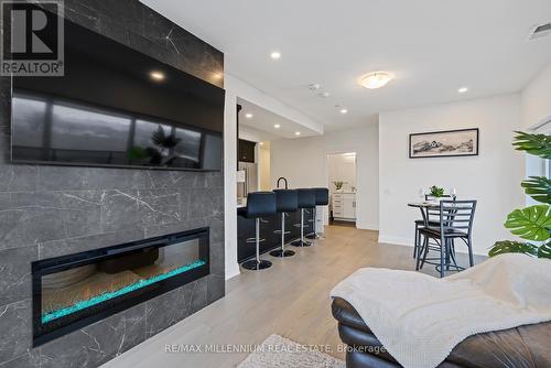 408 - 71 Wyndham Street S, Guelph, ON - Indoor Photo Showing Living Room With Fireplace