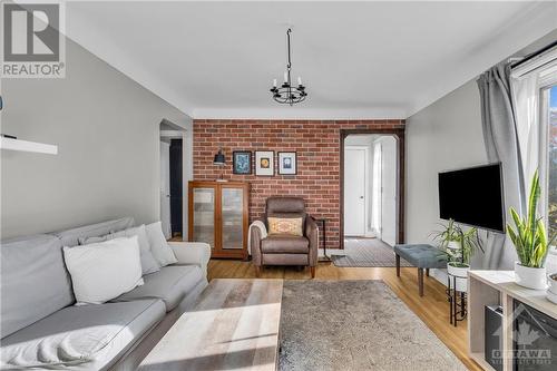 11 St Claire Avenue, Ottawa, ON - Indoor Photo Showing Living Room With Fireplace