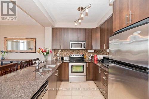 412 - 9235 Jane Street, Vaughan, ON - Indoor Photo Showing Kitchen With Double Sink