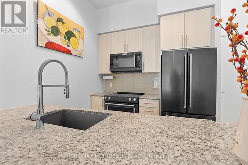 420 - 4055 Parkside Village Drive S, Mississauga, ON - Indoor Photo Showing Kitchen With Stainless Steel Kitchen