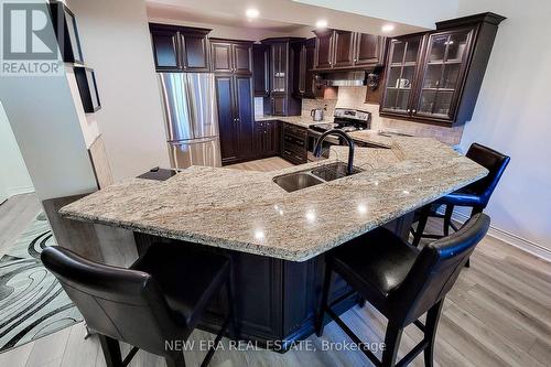 102 - 8111 Forest Glen Drive, Niagara Falls, ON - Indoor Photo Showing Kitchen With Stainless Steel Kitchen With Double Sink