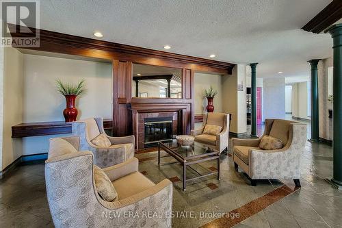 102 - 8111 Forest Glen Drive, Niagara Falls, ON - Indoor Photo Showing Other Room With Fireplace