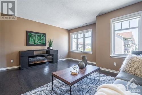 249 Keltie, Ottawa, ON - Indoor Photo Showing Living Room With Fireplace