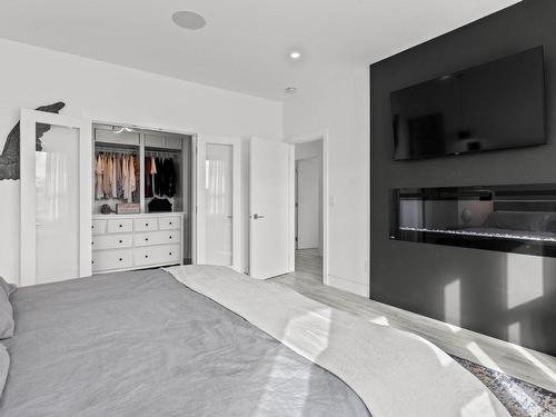 205 Rue Cheval Noir, Kamloops, BC - Indoor Photo Showing Bedroom With Fireplace