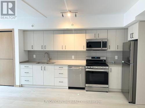 C3 105 - 3427 Sheppard Avenue E, Toronto, ON - Indoor Photo Showing Kitchen With Double Sink