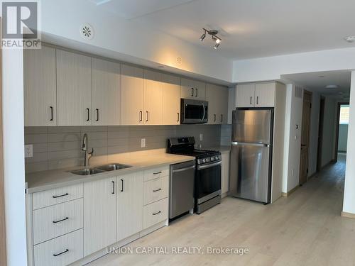 C3 105 - 3427 Sheppard Avenue E, Toronto, ON - Indoor Photo Showing Kitchen With Double Sink